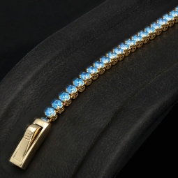 Trendiges Tennisarmband mit funkelnd, blauen Zirkoniasteinen aus 585 14K Gold in (ca. 16,5 cm Länge)